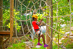 A girl on the kids course at the Family Adventure Park