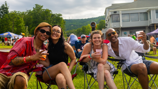 Guest sitting outside at a Summer Festival at Massanutten Resort