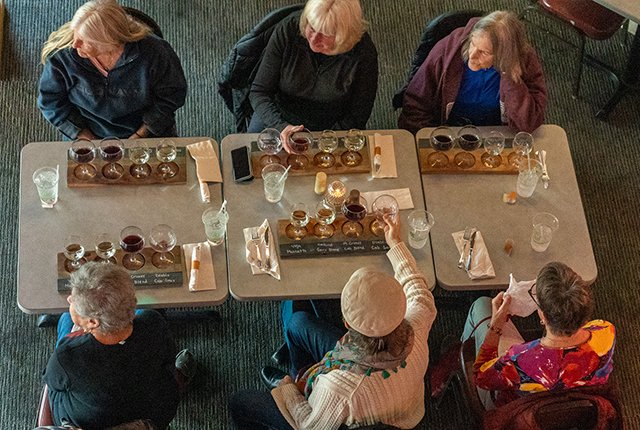 Overhead view of guests enjoying wine flights
