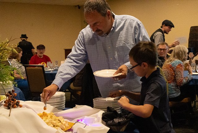 Guests enjoying food at a dining event